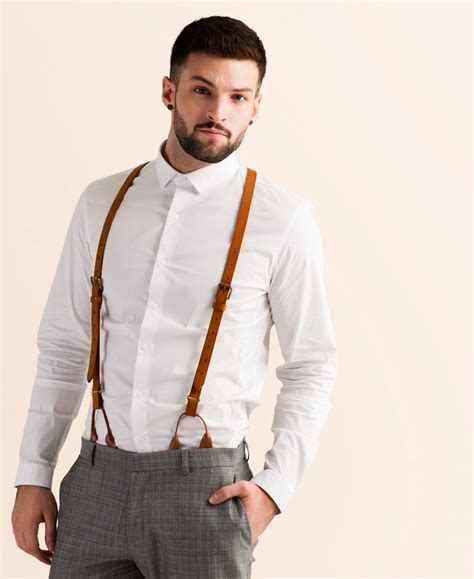 tan suit with suspenders.